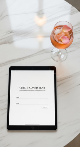 190 Flat lay of an iPad on a marble desk showing a lead capture form and a glass of ros Text CHIC CO.jpg