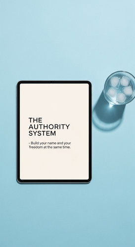 194 Flat lay of an iPad on a light blue background and a glass of water Text THE AUTHORITY SYSTEM Bu.jpg