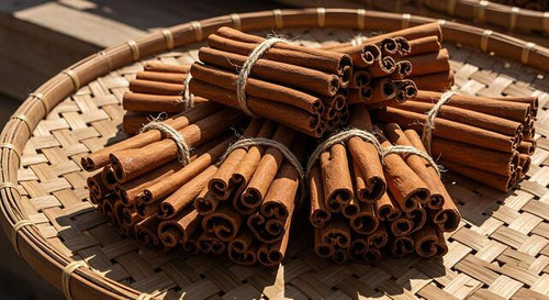 bundles of cinnamon sticks on woven tray brown spices natural ingredients free photo.jpg