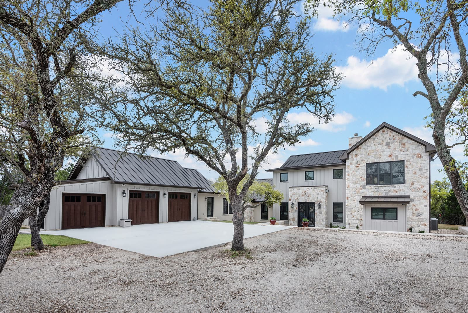 Luxury new construction home in the San Antonio Hill Country with stone exterior and modern design