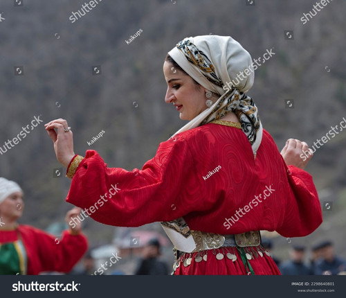 stock photo tliarata russia april a beautiful woman in a red national costume performs a dagestan 22.jpg