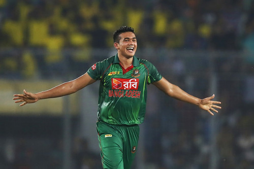 Bangladesh's Taskin Ahmed celebrates the dismissal of Afghanistan's Rahmat Shah during the third one.jpg