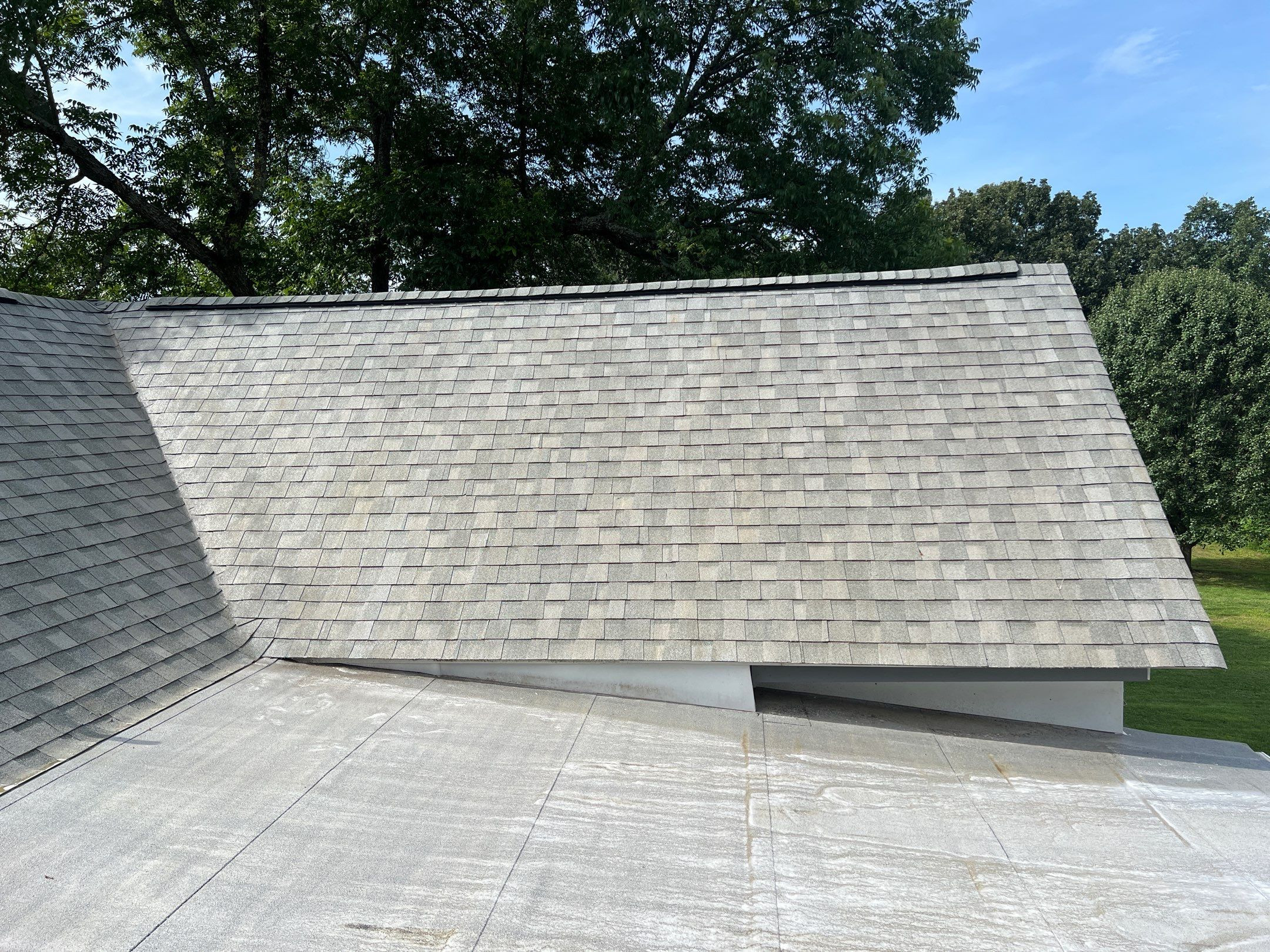Close-up of clean asphalt shingles after soft wash roof cleaning