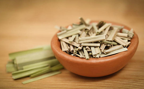 Lemongrass in a bowl on wooden surface.jpg