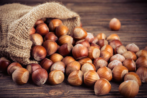hazelnuts on wooden background.jpg