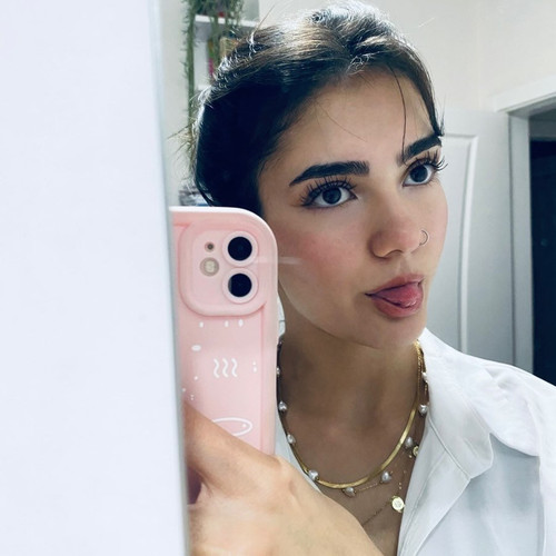 selfie girl pink iphone tongue out.jpg