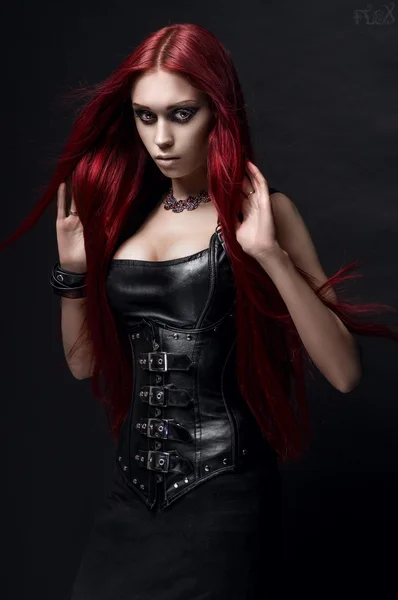 depositphotos 104946576 stock photo woman in black leather clothes.webp