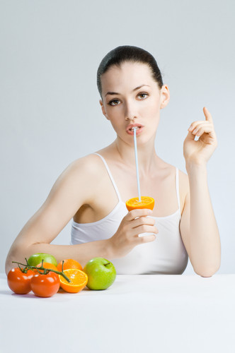 A beautiful slender girl eating healthy food.jpg